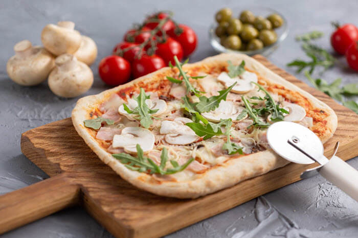 pizza on cutting board